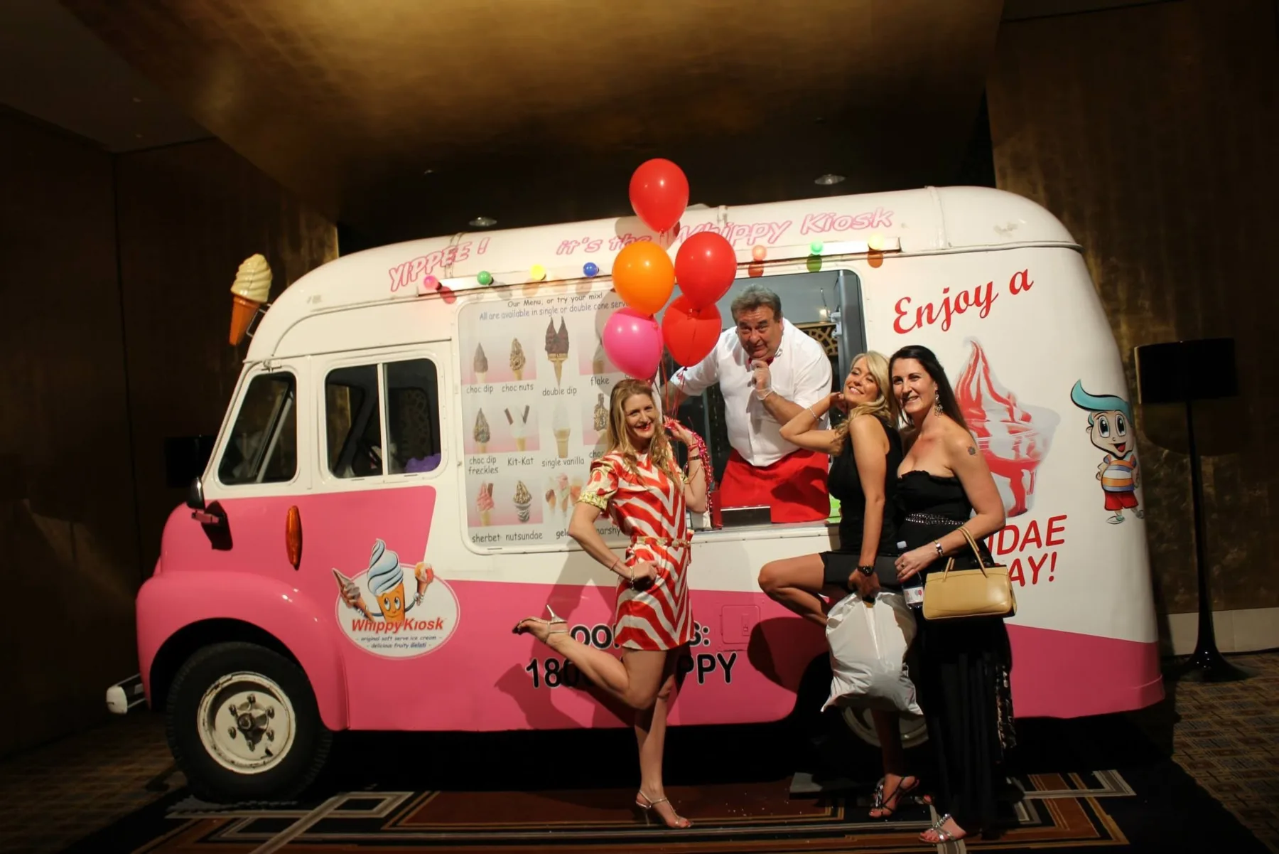 The classic pink and white ice cream van with guests during a Cancer Council fundraiser inside Crown Casino