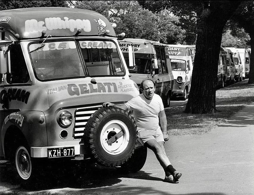 A line of Mr Whippy ice cream vans waiting to serve crowds at Melbourne’s Moomba Festival, with the family van in the foreground