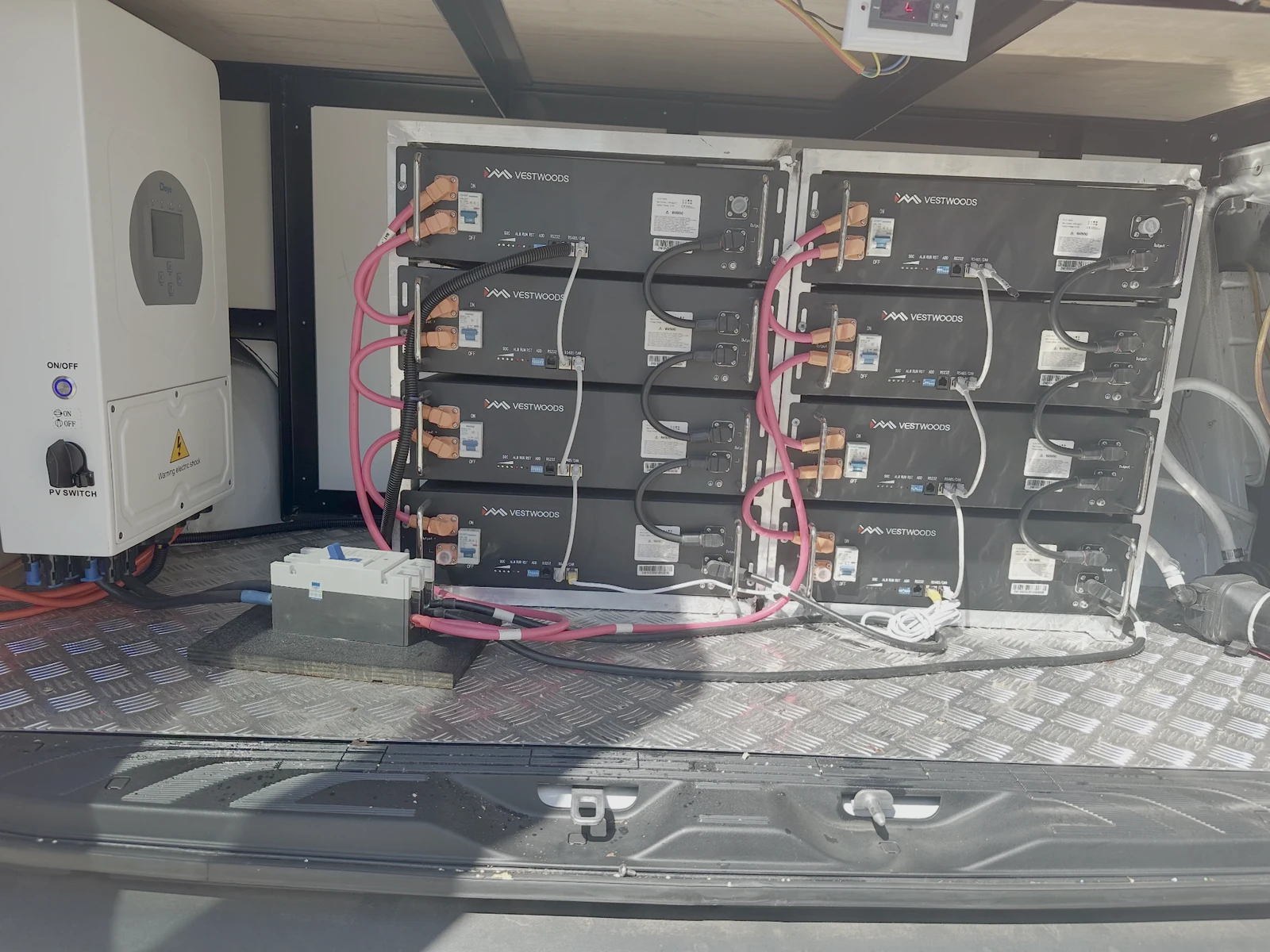 High-capacity battery modules and solar power control equipment installed inside a new Mr Softy ice cream van