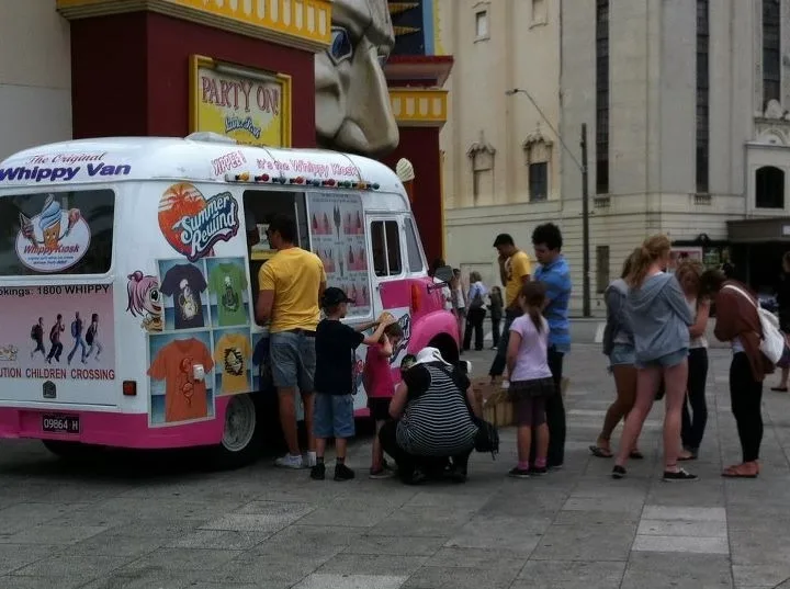 Families gathered around the pink and white ice cream van during the Schweppes Summer Rewind campaign