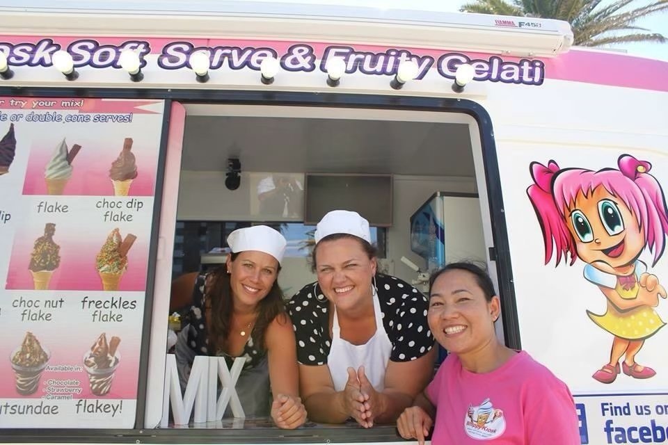 Event team serving from a branded ice cream van