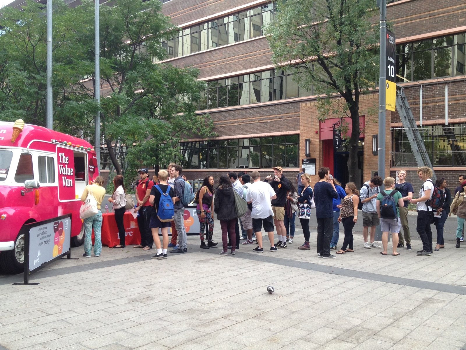 Branded ice cream van serving a large event